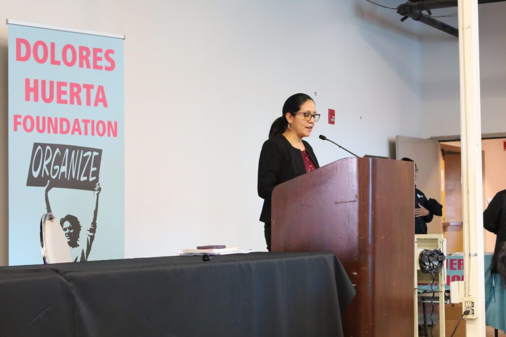 Camila Chavez presenting the South Central Valley Needs Assessment report at an event on Oct. 14